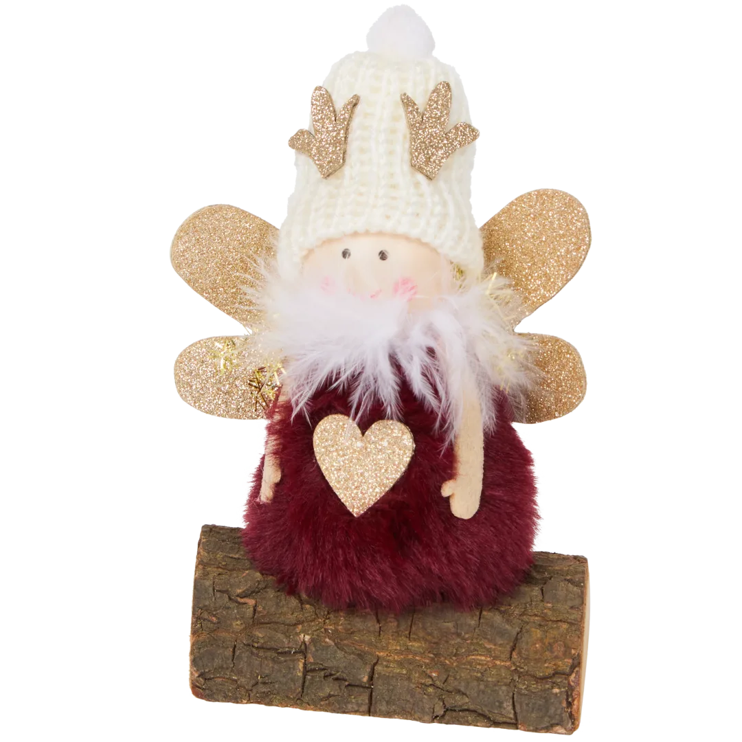 Ángel de Navidad en tronco